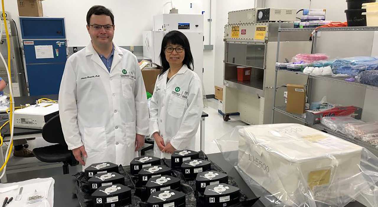 Chunhui Xu and Antonio Rampoldi, a postdoctoral fellow at Emory University, pack their cell culture hardware modules for the MVP Cell-03 investigation before launch.