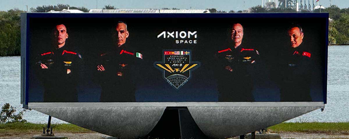 The countdown clock at NASA's Kennedy Space Center displays images of the AX-3 crew prior to launch
