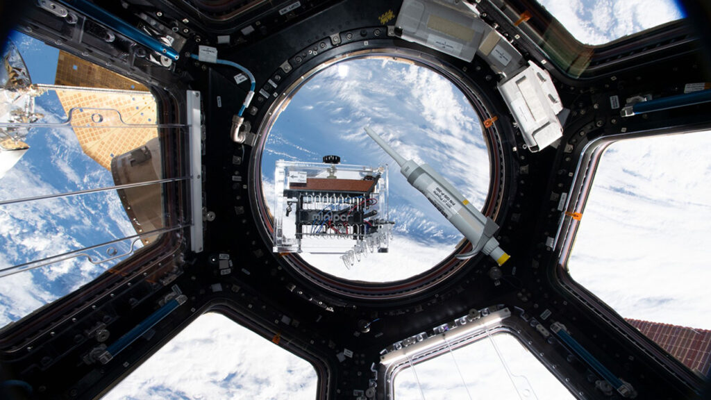 A view of the miniPCR device in the cupola on the International Space Station.