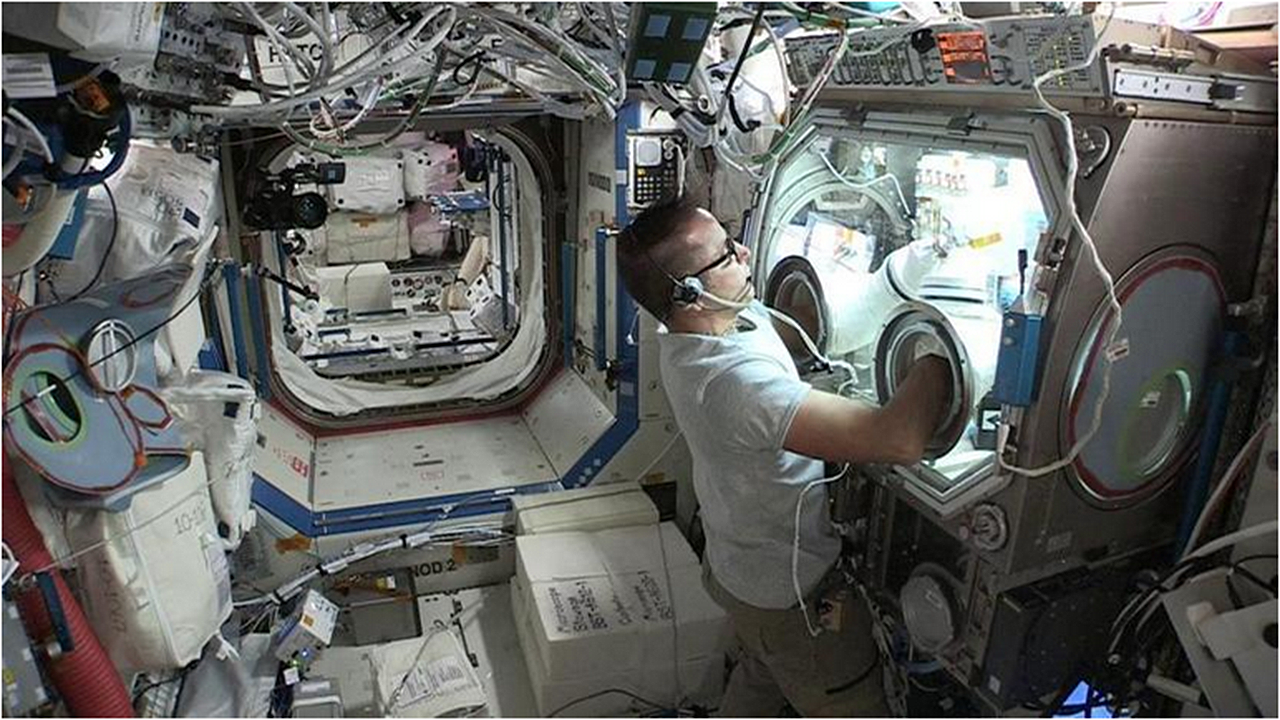 NASA astronaut Joe Acaba working on the LaunchPad Medical investigation onboard the ISS.