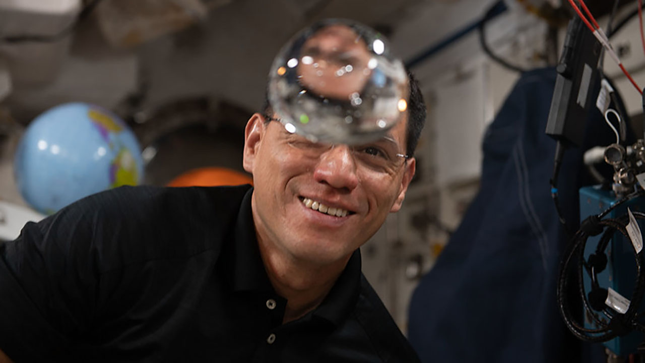 ss068e006386 (Oct. 1, 2022) NASA astronaut and Expedition 68 Flight Engineer Frank Rubio has fun with fluid physics as he observes the behavior of a free flying water bubble inside the International Space Stations Kibo laboratory module.