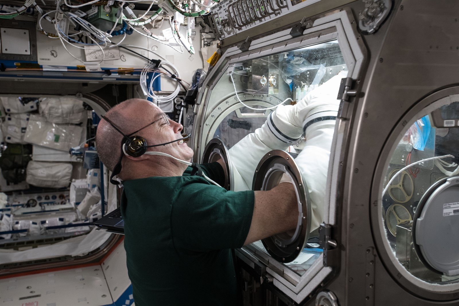 NASA Astronaut Scott Tingle works with 490 BioTechs Metabolic Tracking experiment onboard the ISS.