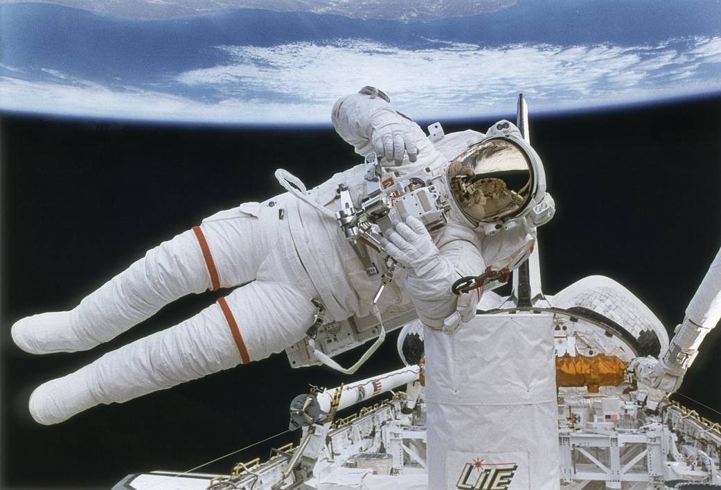 Astronaut Mark Lee tests the new backpack called Simplified Aid for EVA Rescue (SAFER), a system designed for use in the event a crew member becomes untethered while conducting an EVA. The Lidar In Space Technology Experiment (LITE) is shown in the foreground. The LITE payload employs lidar, which stands for light detection and ranging, a type of optical radar using laser pulses instead of radio waves to study Earths atmosphere. Unprecedented views were obtained of cloud structures, storm systems, dust clouds, pollutants, forest burning, and surface reflectance. The STS 64 mission marked the first untethered U.S. EVA in 10 years, and was launched on September 9, 1994, aboard the Space Shuttle Orbiter Discovery.