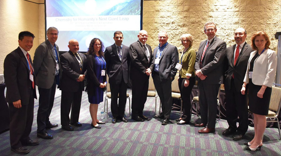 Speakers at the ACS Chemistry for Humanitys Next Giant Leap symposium, including International Space Station U.S. National Laboratory Associate Program Scientist Kenneth Savin (fifth from right).