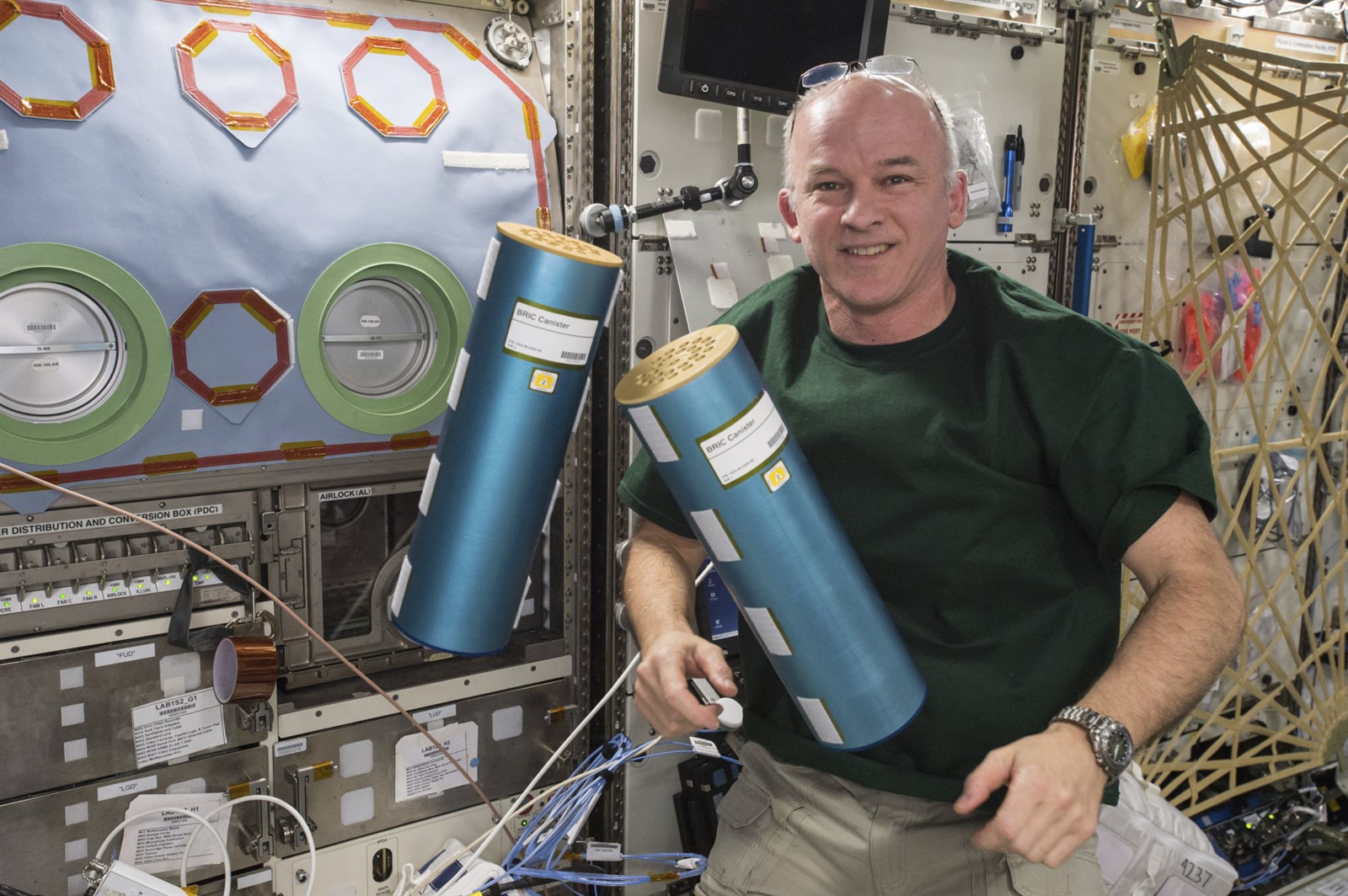 NASA astronaut Jeff Williams prepares canisters for return to Earth for the BRIC Natural Products investigation, in which radiation tolerant fungal strains isolated from the Chernobyl nuclear power plant site were exposed to spaceflight conditions on the ISS and then screened for the biological production of beneficial agricultural or biomedical compounds.