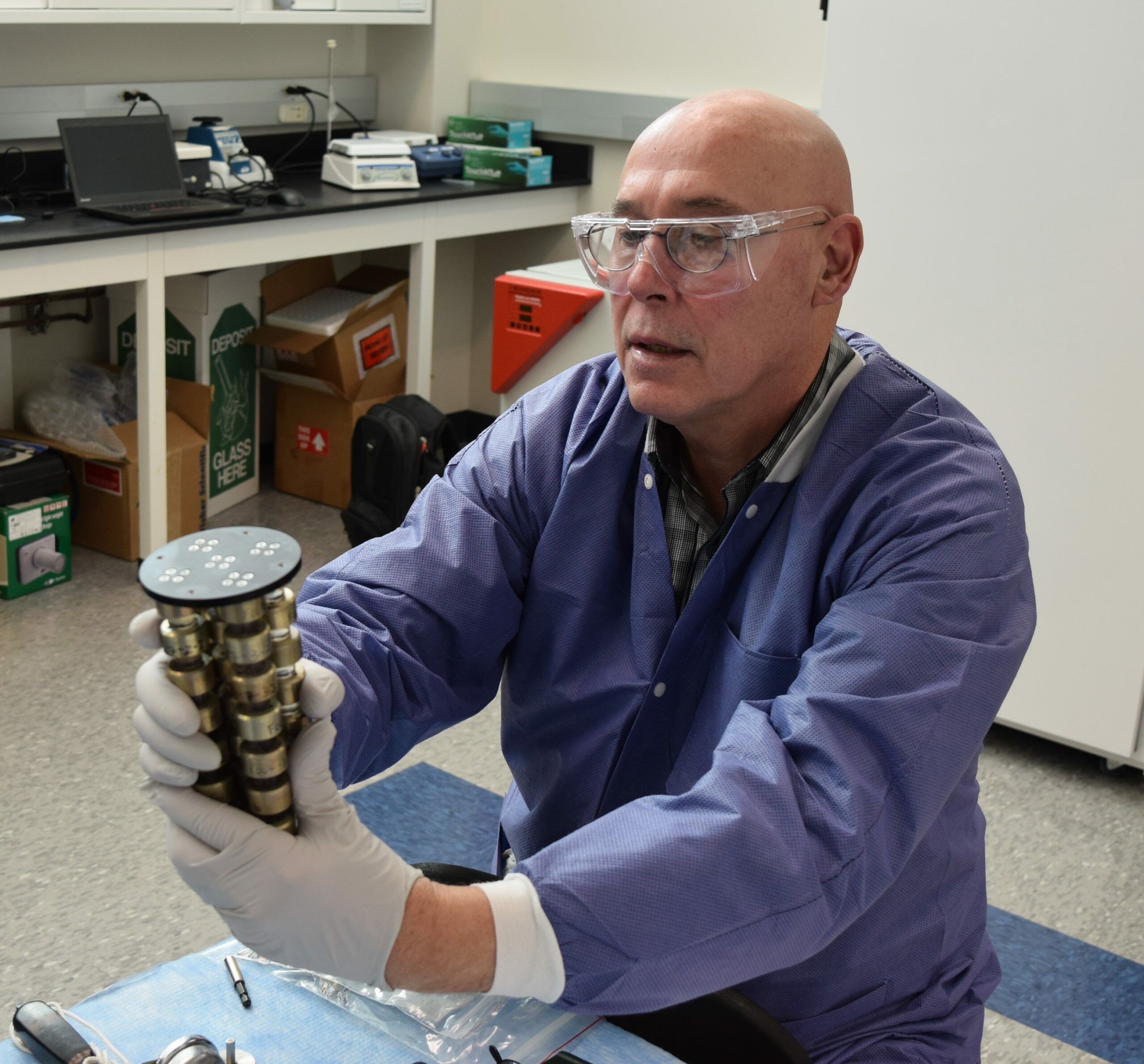 Paul Reichert preparing the Protein Crystallization Facility hardware prior to launch on SpaceX CRS 10.