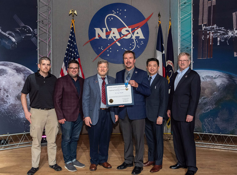 The HPE SBC 1 team was awarded NASAs Exceptional Technology Achievement Medal for the first successful demonstration of a COTS supercomputing platform on the ISS and for executing more than one trillion calculations per second for a year. (The HPE SBC 1 team, from left to right: Mike Scott, Rob Behringer, Mark Fernandez, Dave Petersen, Eng Lim Goh, John Kichury)