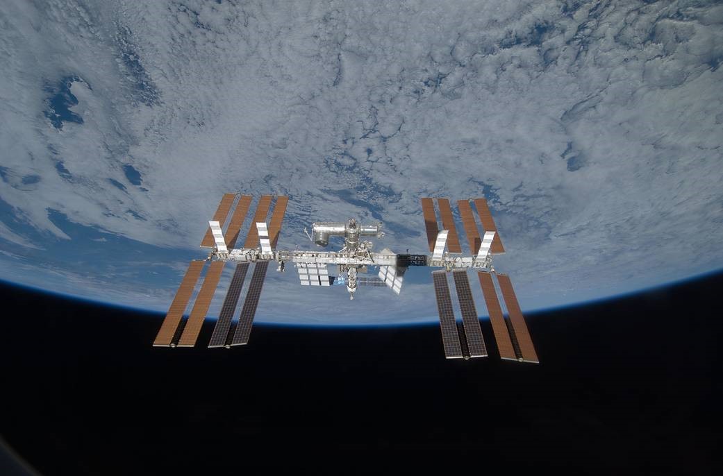 Suspended in space and backdropped by the blackness of space and the jewel like blue of Earth sits the International Space Station. This image of the station was taken as STS 119 performed a fly around after undocking.