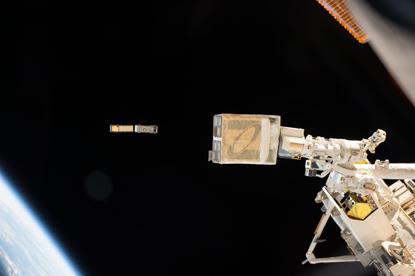 The CXBN 2 and IceCube CubeSats being deployed from the NanoRacks deployer on the International Space Station. These are two of the three CubeSat payloads that make up NASAs ELaNa 17 mission, which launched to the space station in April 2017.
