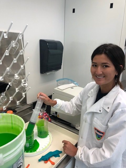 ISS National Lab intern Kaitlin Ruether handling Nickelodeon slime prior to the launch of the Nickelodeon Slime in Space payload on SpaceX CRS 18.