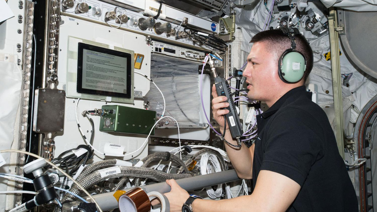 NASA Astronaut Kjell Lindgren operates the amateur radio onboard the ISS.
