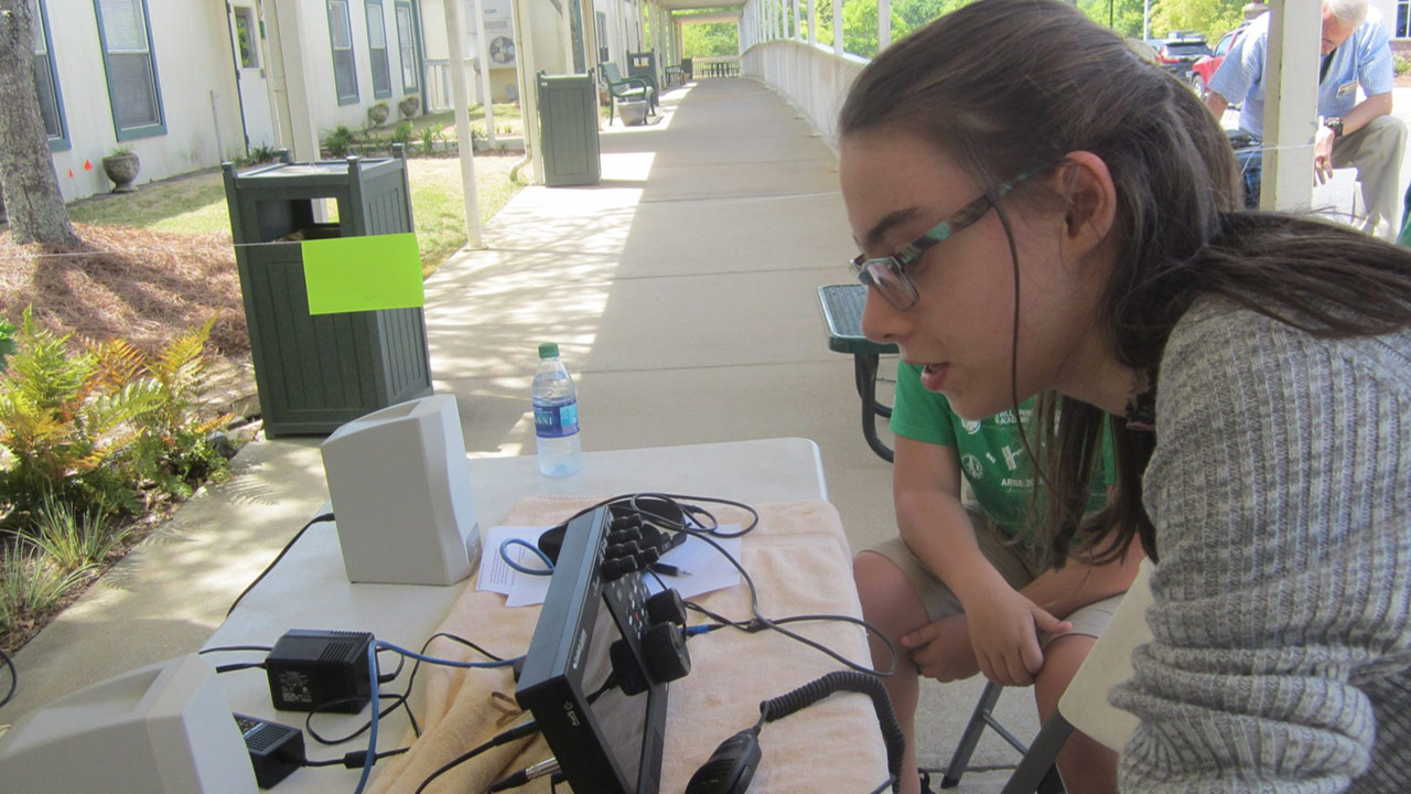 Lydia Bennett at a science day ham radio exhibit.