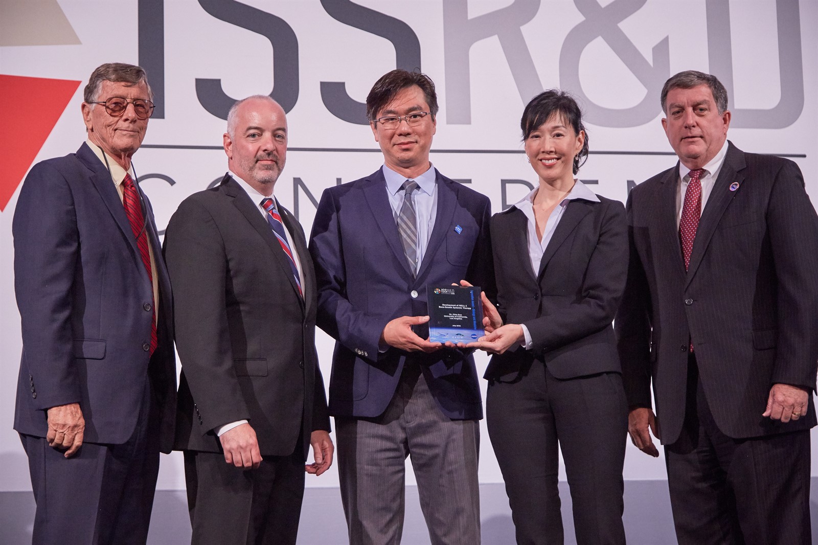 Chia Soo and Kang Ting of UCLA receive the 2018 International Space Station Innovation Award in Biology and Medicine.