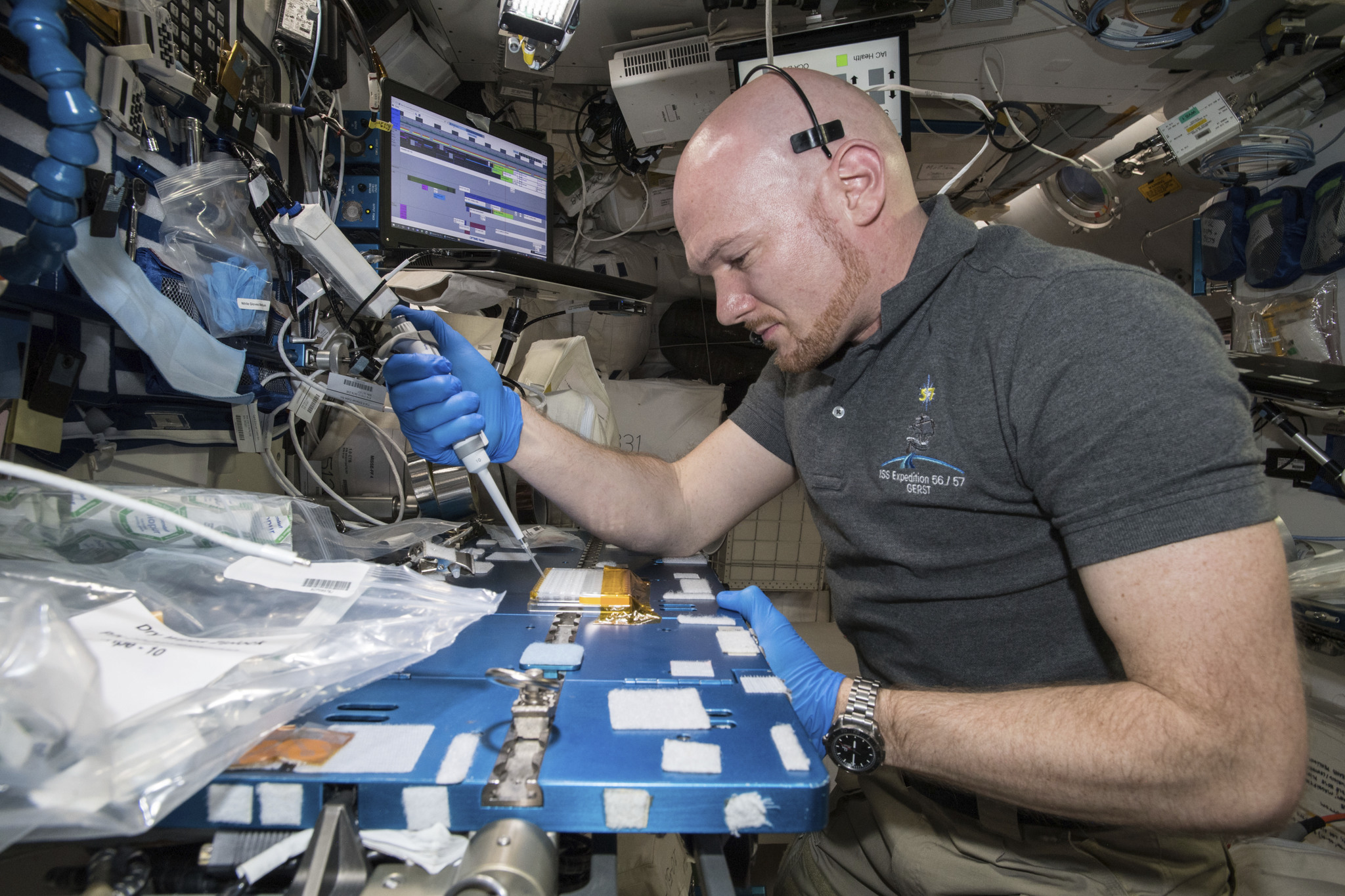 European Space Agency astronaut Alexander Gerst works on the LRRK2 protein crystallization experiment from The Michael J. Fox Foundation onboard the International Space Station.