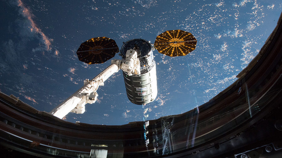 This view taken from inside the Cupola shows the Orbital ATK space freighter moments before it was grappled with the Canadarm2 robotic arm on May 24, 2018.