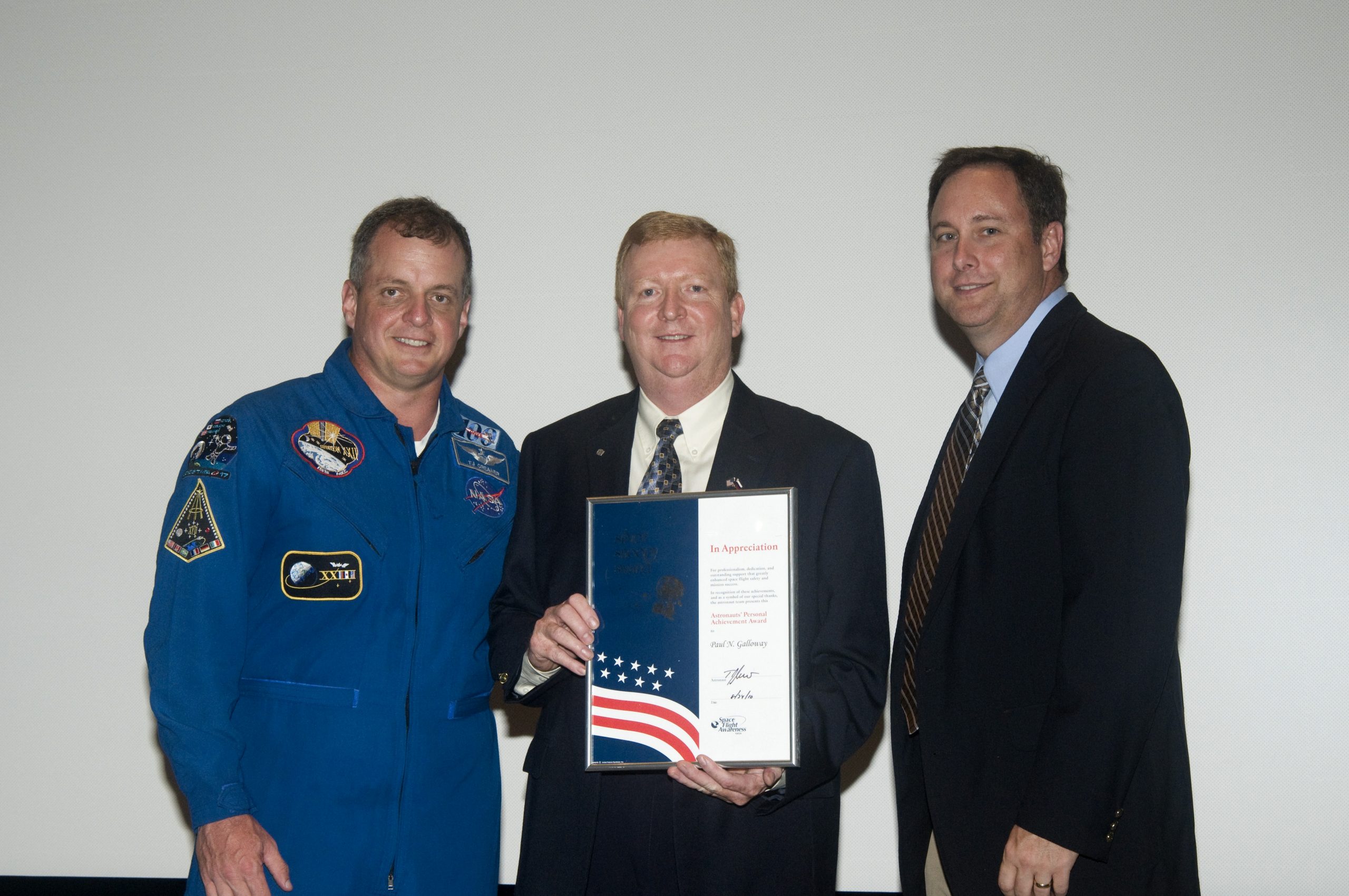 Paul Galloway receiving the Silver Snoopy award for astronaut safety and scientific utilization of the ISS in 2010.