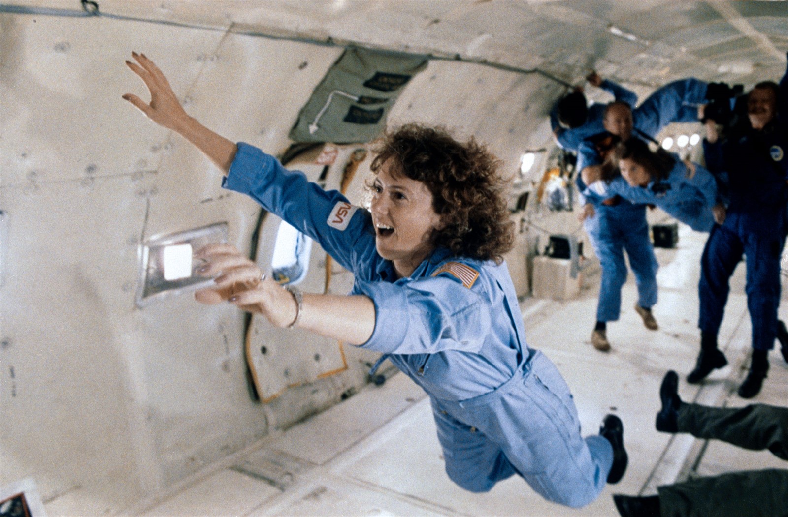 Sharon Christa McAuliffe, STS 51L citizen observer payload specialist, representing the Teacher in Space Project, floats forward and upward during a few moments of weightlessness aboard a KC 135 aircraft.