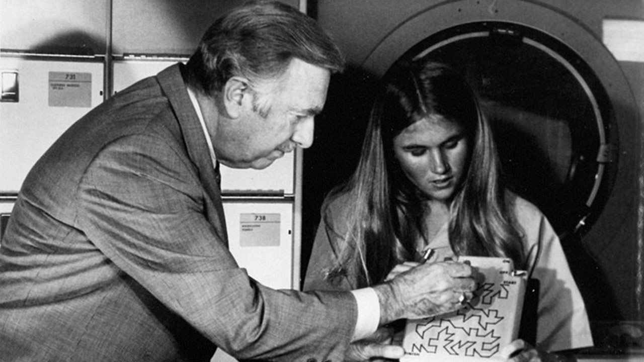 Skylab student scientist Kathy Jackson demonstrates her sensory motor project to Walter Cronkite.