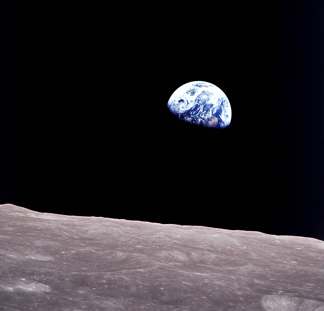 Taken aboard Apollo 8 by Bill Anders, this iconic picture shows Earth peeking out from beyond the lunar surface as the first crewed spacecraft circumnavigated the moon.