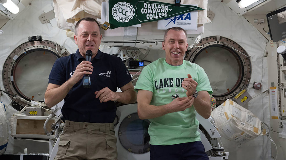 iss055e035373 (April 17, 2018) NASA astronauts Ricky Arnold (left) and Drew Feustel are pictured inside the Japanese Kibo laboratory module talking to high school and college students from Lake Orion, Mich.