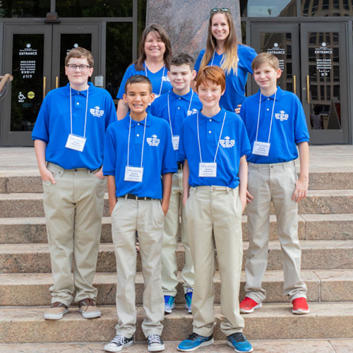SSEP Team Penicillium Mold Growth with teacher Laura Smith in front of the Smithsonian National Air and Space Museum