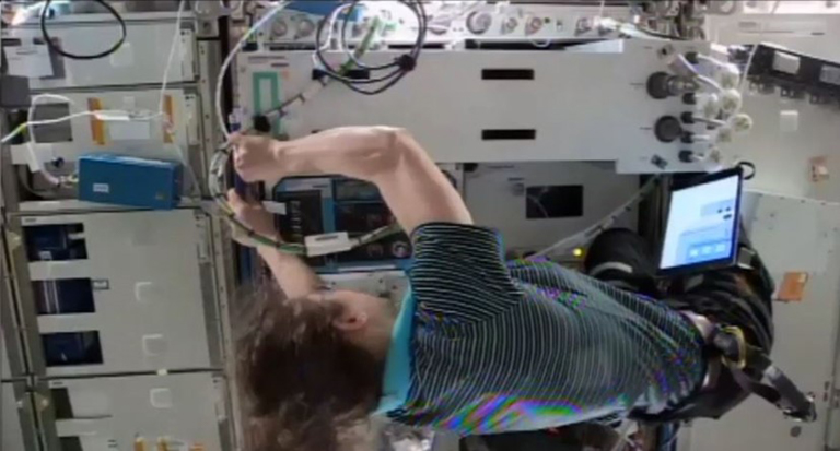 NASA astronaut Christine Koch prepares SBC 1 for its flight home.