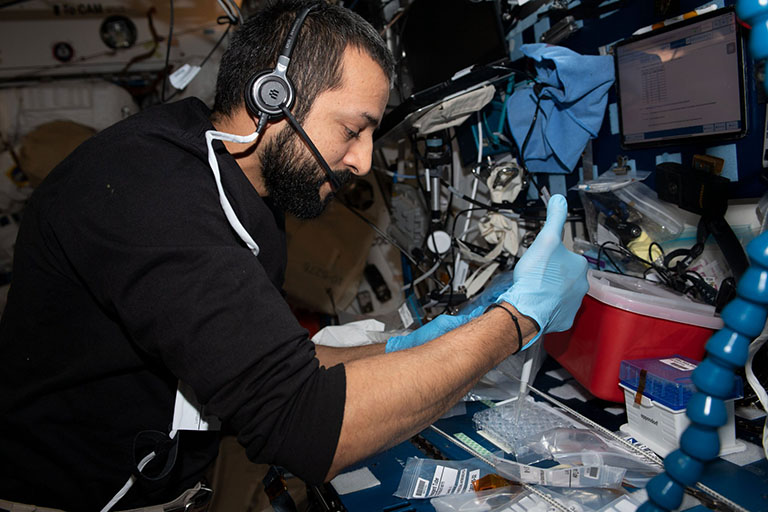 UAE astronaut Sultan Alneyadi works on the BMC protein crystal growth experiment.