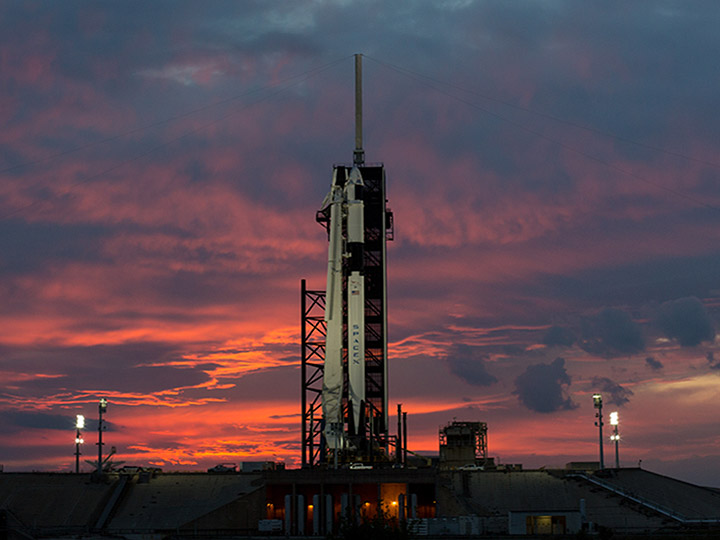 A SpaceX Falcon 9 rocket with the companys Crew Dragon spacecraft onboard is seen at sunset on the launch pad at Launch Complex 39A as preparations continue for the Demo 1 mission, Friday, March 1, 2019 at the Kennedy Space Center in Florida. The Demo 1 mission launched at 2:49am ET on Saturday, March 2 and was the first launch of a commercially built and operated American spacecraft and space system designed for humans as part of NASAs Commercial Crew Program. The mission will serve as an end to end test of the systems capabilities.