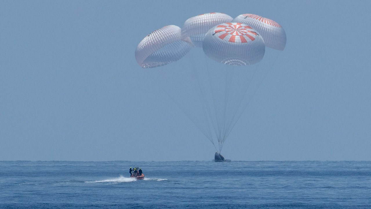 The SpaceX Crew Dragon Endeavour spacecraft is seen as it lands with NASA astronauts Robert Behnken and Douglas Hurley onboard in the Gulf of Mexico off the coast of Pensacola, Florida, Sunday, Aug. 2, 2020. The Demo 2 test flight for NASAs Commercial Crew Program was the first to deliver astronauts to the International Space Station and return them safely to Earth onboard a commercially built and operated spacecraft. Behnken and Hurley returned after spending 64 days in space.