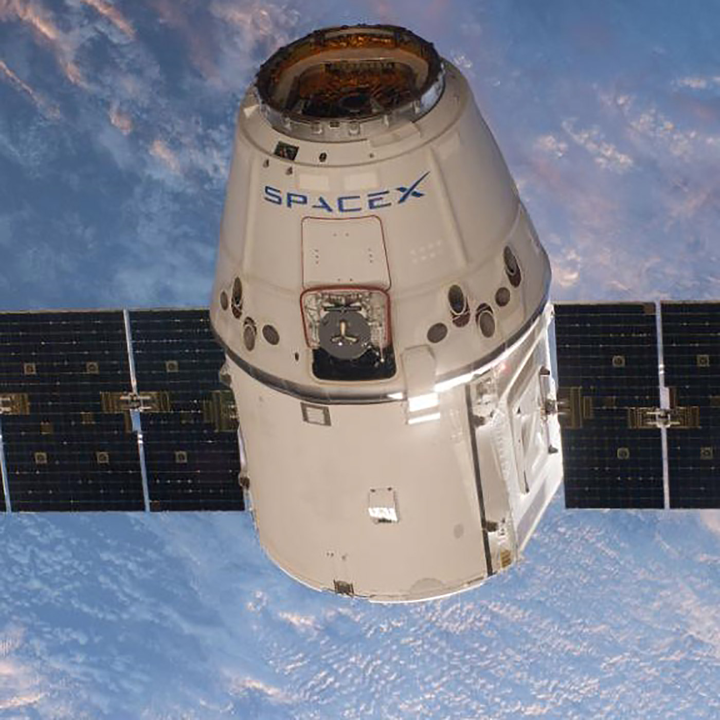 SpaceXs Dragon cargo vehicle approaches the International Space Station to deliver almost 4,800 pounds of cargo and scientific experiments