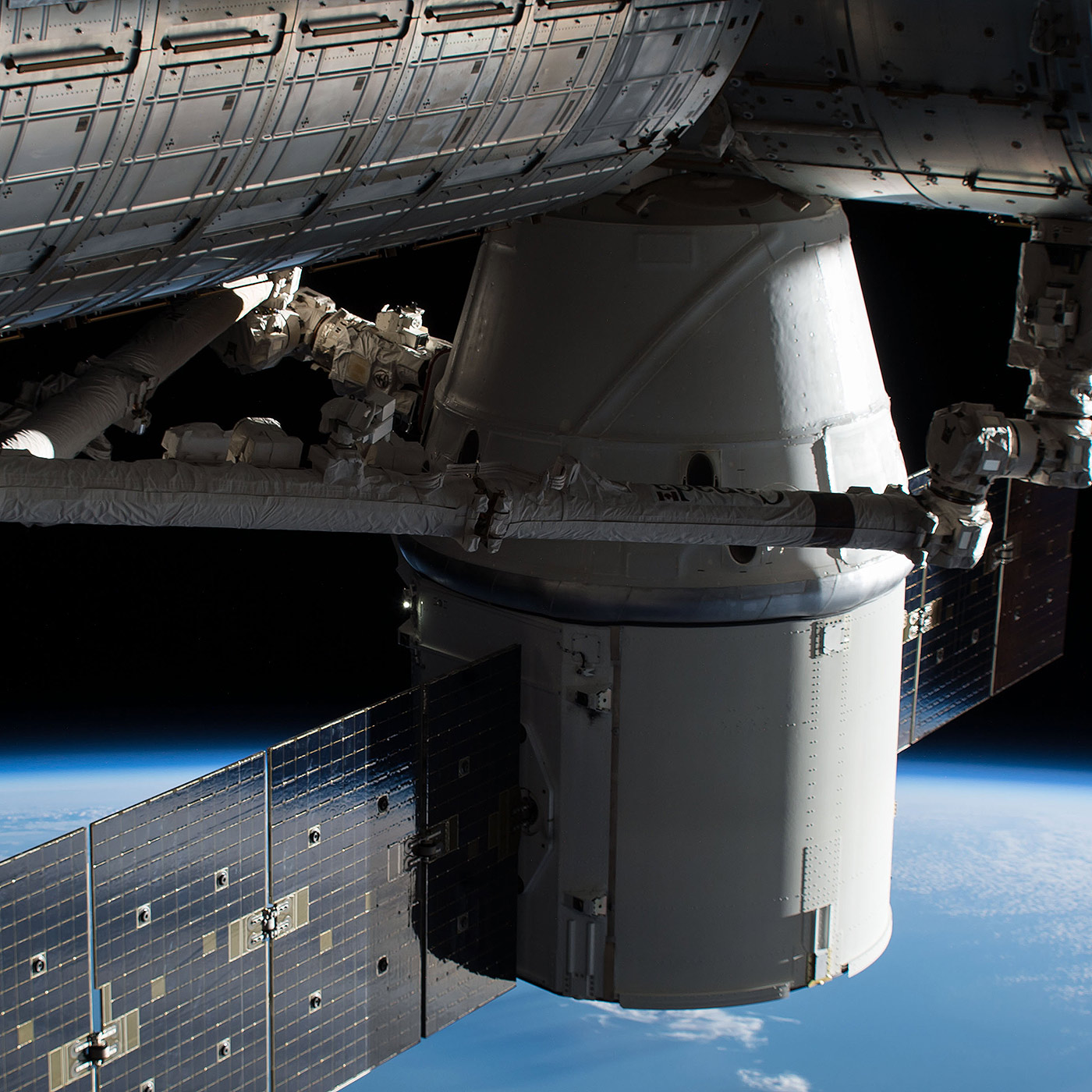 e SpaceX Dragon cargo craft is pictured attached to the Harmony module of the International Space Station after it arrived on Dec. 17. 2017.