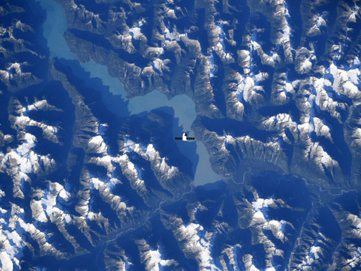 Science and Cargo The SpaceX Dragon resupply ship is pictured above the Canadian Rocky Mountains The SpaceX Dragon resupply ship is pictured above the Canadian Rocky Mountains after it departed the International Space Station today.