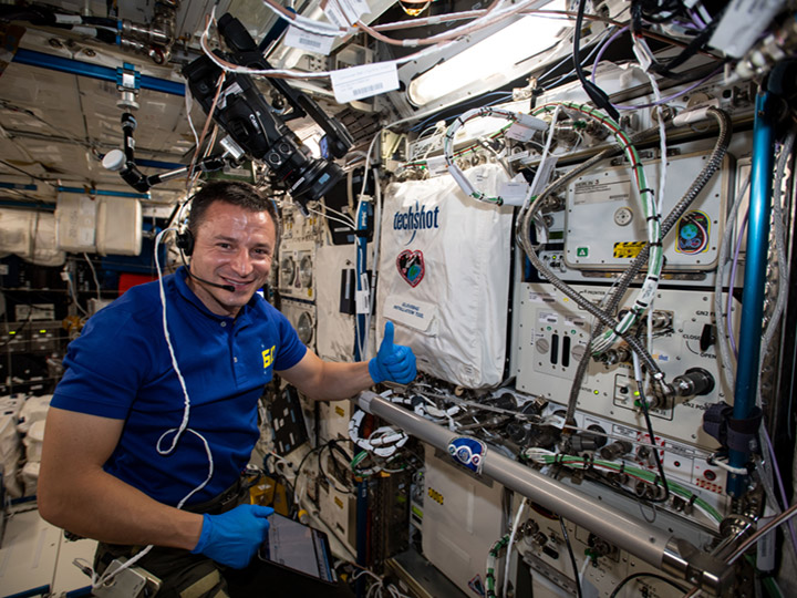 NASA astronaut Andrew Morgan works on setting up the BioFabrication Facility to test print tissues as part of an investigation into whether human organs can be 3D printed in the weightless environment of space.