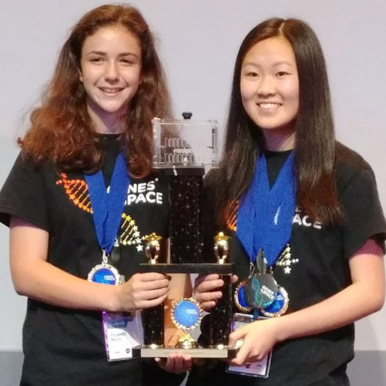 High school students Elizabeth Reizis (left) and Sophia Chen tied for first place in the 2017 Genes in Space competition.