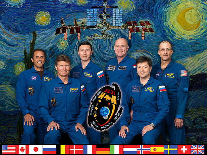 SS031 S 002 (14 July 2011) Expedition 31 crew members take a break from training at NASAs Johnson Space Center to pose for a crew portrait. Pictured on the front row are Russian cosmonauts Oleg Kononenko (right), commander; and Gennady Padalka, flight engineer. Pictured from the left (back row) are NASA astronaut Joe Acaba, Russian cosmonaut Sergei Revin, European Space Agency astronaut Andre Kuipers and NASA astronaut Don Pettit, all flight engineers.