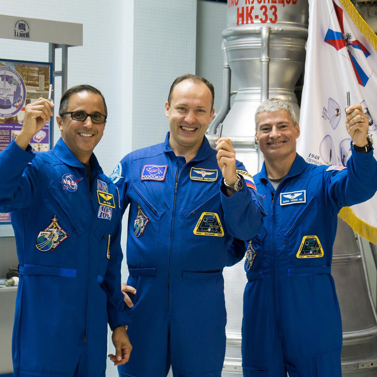 jsc2017e115134 (Sept. 7, 2017) In the Korolev Museum at the Baikonur Cosmodrome in Kazakhstan, Expedition 53 54 crewmembers Joe Acaba of NASA (left), Alexander Misurkin of Roscosmos (center) and Mark Vande Hei of NASA (right) display launch keys during a museum visit Sept. 7 as part of pre launch activities. They will launch Sept. 13 on the Soyuz MS 06 spacecraft for a five and a half month mission on the International Space Station. Credit: NASA Victor Zelentsov