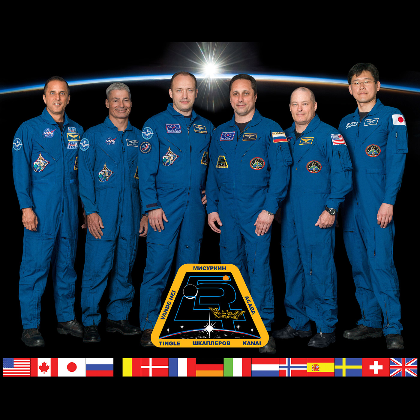 The six member Expedition 54 crew poses for an official crew portrait at the Johnson Space Center in Houston, Texas. From left are Flight Engineers Joe Acaba and Mark Vande Hei of NASA, Commander Alexander Misurkin of Roscosmos and Flight Engineers Anton Shkaplerov of Roscosmos, Scott Tingle of NASA and Norishige Kanai of the Japan Aerospace Exploration Agency.