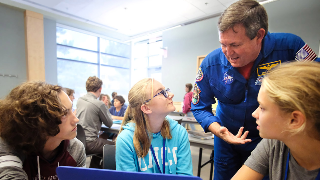 An astronaut participates in classroom activities during the Go For Launch! program by Higher Orbits.