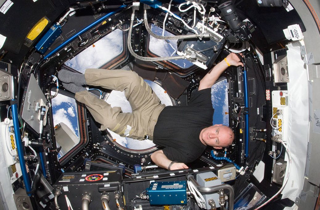 NASA astronaut Scott Kelly, Expedition 25 flight engineer, is pictured in the Cupola of the International Space Station on Oct. 14, 2010. NASA has selected Kelly for a one year mission aboard the station in 2015. Kelly will join Russian cosmonaut Mikhail Kornienko on a mission that will collect scientific data important to future human exploration of our solar system. The goal of the yearlong expedition aboard the orbiting laboratory is to understand better how the human body reacts and adapts to the harsh environment of space. Data from the 12 month expedition will help inform current assessments of crew performance and health and will determine better and validate countermeasures to reduce the risks associated with future exploration as NASA plans for missions around the moon, an asteroid and ultimately Mars.