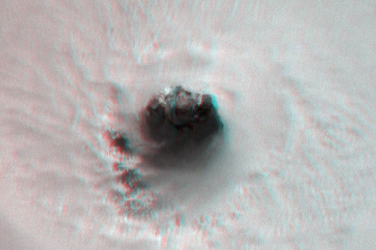 This black and white image provides a close up view of the 34 kilometer (21 mile) wide eye of Hurricane Harvey. This view covers an area of about 150 kilometers by 100 kilometers (93 miles by 62 miles). This image provides a clear view into the eye of Harvey as the rapidly intensifying storm approached the coast of Texas. At this point, the surface winds were 200 kilometers per hour (125 mph) and increasing. The clouds that form the eyewall (the boundary around the hurricanes eye) look dramatic in 3D.