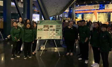 Team members from iLEAD Lancaster and iLEAD Agua Dulce Launch Team Aloe with their poster.