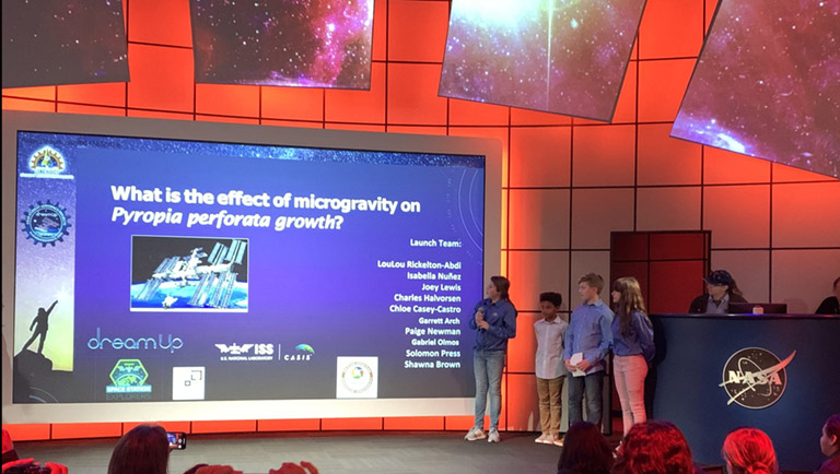 Student LouLou Rickelton Abdi introduces team members from SCVis Launch Team Pryopia during the teams presentation at the Kennedy Space Center Visitor Complex.