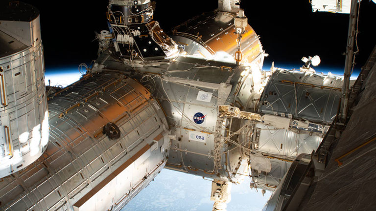 The forward end of the International Space Station is pictured showing portions of five modules. From right to left is a portion of the U.S. Destiny laboratory module linking forward to the Harmony module. Attached to the port side of Harmony (left foreground) is the Kibo laboratory module from the Japan Aerospace Exploration Agency (JAXA) with its logistics module berthed on top. On Harmonys starboard side (center background) is the Columbus laboratory module from ESA (European Space Agency).