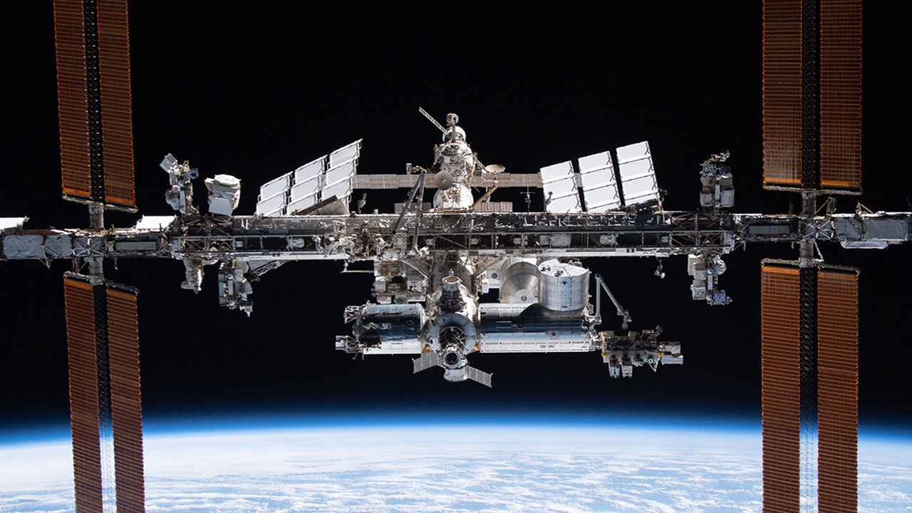 iss066e081130 (Nov. 8, 2021) The International Space Station is pictured from the SpaceX Crew Dragon Endeavour during a fly around of the orbiting lab that took place following its undocking from the Harmony modules space facing port on Nov. 8, 2021. The orbital complex was flying 263 miles above the Marshall Islands in the Pacific Ocean when this photograph was taken.