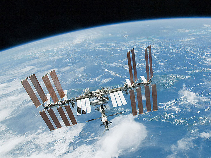 iss over blue white earth