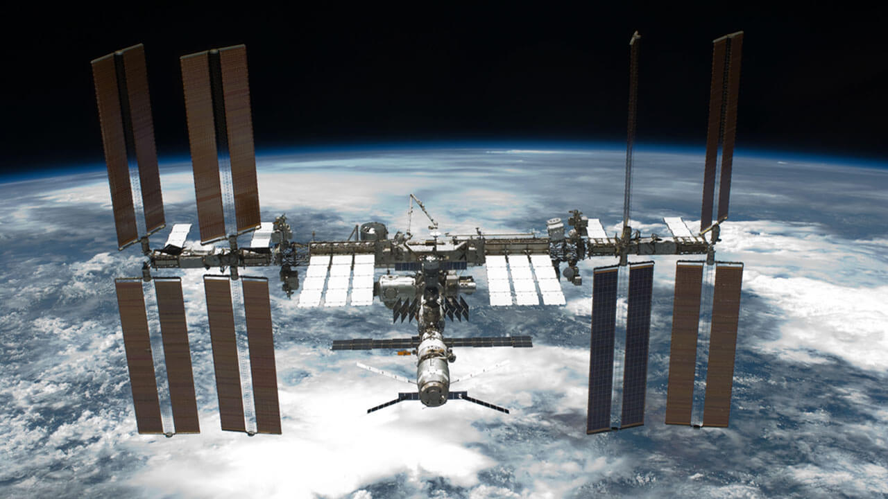 iss over cloudy earth