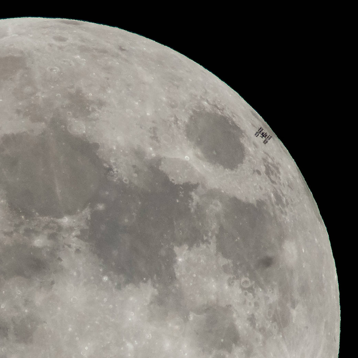 The International Space Station, with a crew of six onboard, is seen in silhouette as it transits the moon at roughly five miles per second on Tuesday, Jan. 30, 2018, from Alexandria, Va