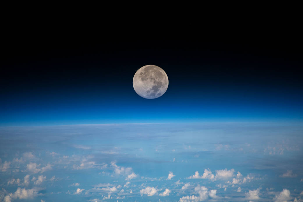 The full moon is pictured as the International Space Station orbited 254 miles above the Pacific Ocean northeast of Guam. Working with U.S. companies and international partners, NASA is pushing the boundaries of human exploration forward to the Moon and on to Mars.