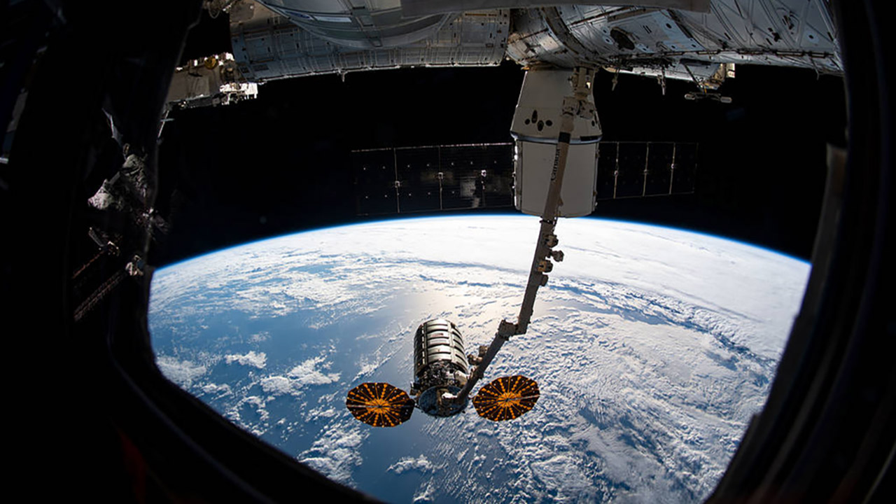 iss060e022993 (Aug. 6, 2019) The Cygnus resupply spacecraft from Northrop Grumman is shown grappled by the Canadarm2 robotic arm following its detachment from the Unity module and just before release. Behind the robotic arm, the SpaceX Dragon is seen still attached to the Unity module of the International Space Station. Last Updated: Aug 24, 2019