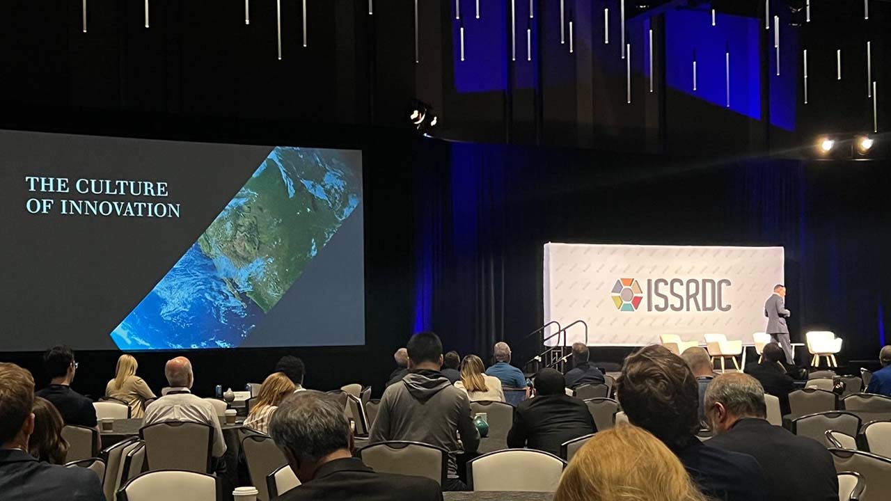 At ISSRDC 2023, Eric Moore, senior VP and chief technology officer for Leidos, gave a Lightning Talk on the power of the collective mind. He attributed the success of Leidos to the companys values that encourage taking advantage of the innovation that results from bringing people together to collaborate and challenge the status quo.